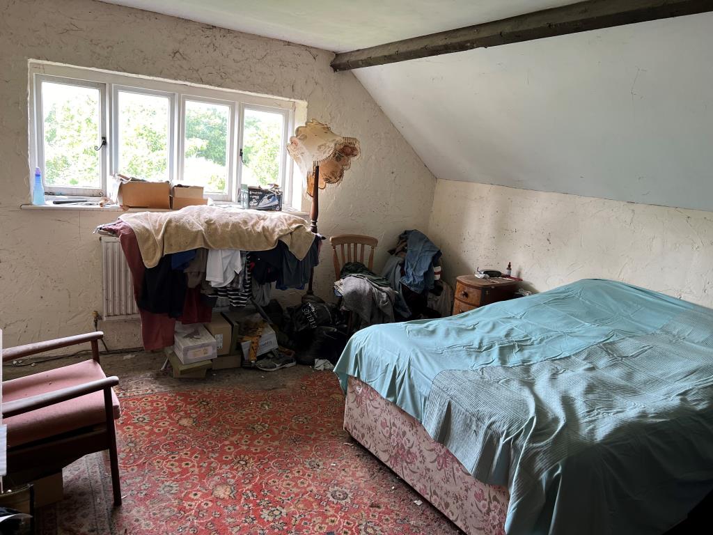Lot: 128 - THREE-BEDROOM COTTAGE FOR IMPROVEMENT IN POPULAR VILLAGE LOCATION - Rear Bedroom